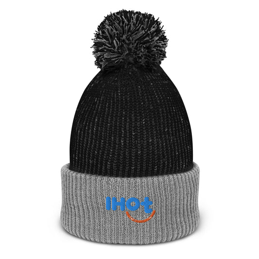 The Isaac Hadden Organ trio logo on a winter knit stocking cap. The stocking cap is black and grey, with a cute frizzled looking black poof ball on the top.